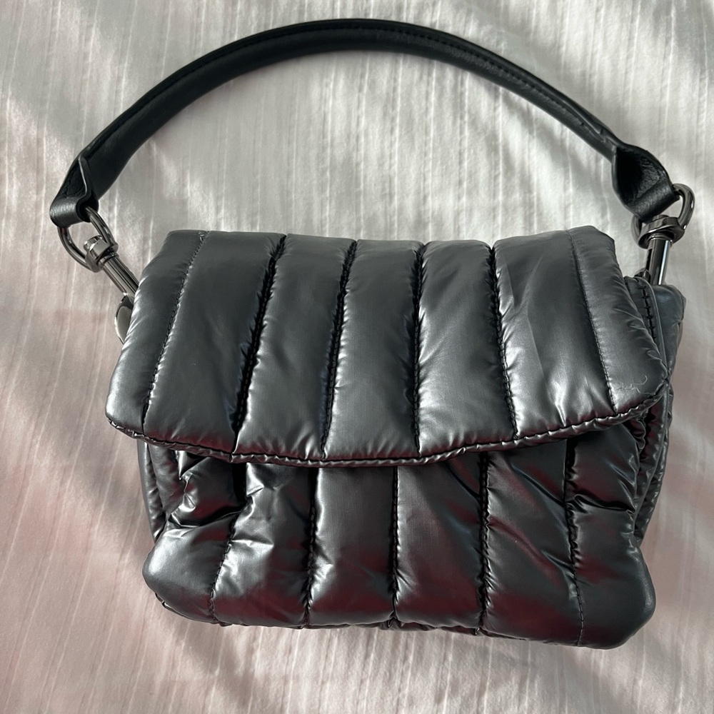 Think Royln petite Bar Bag never used.  Slightly defective silver